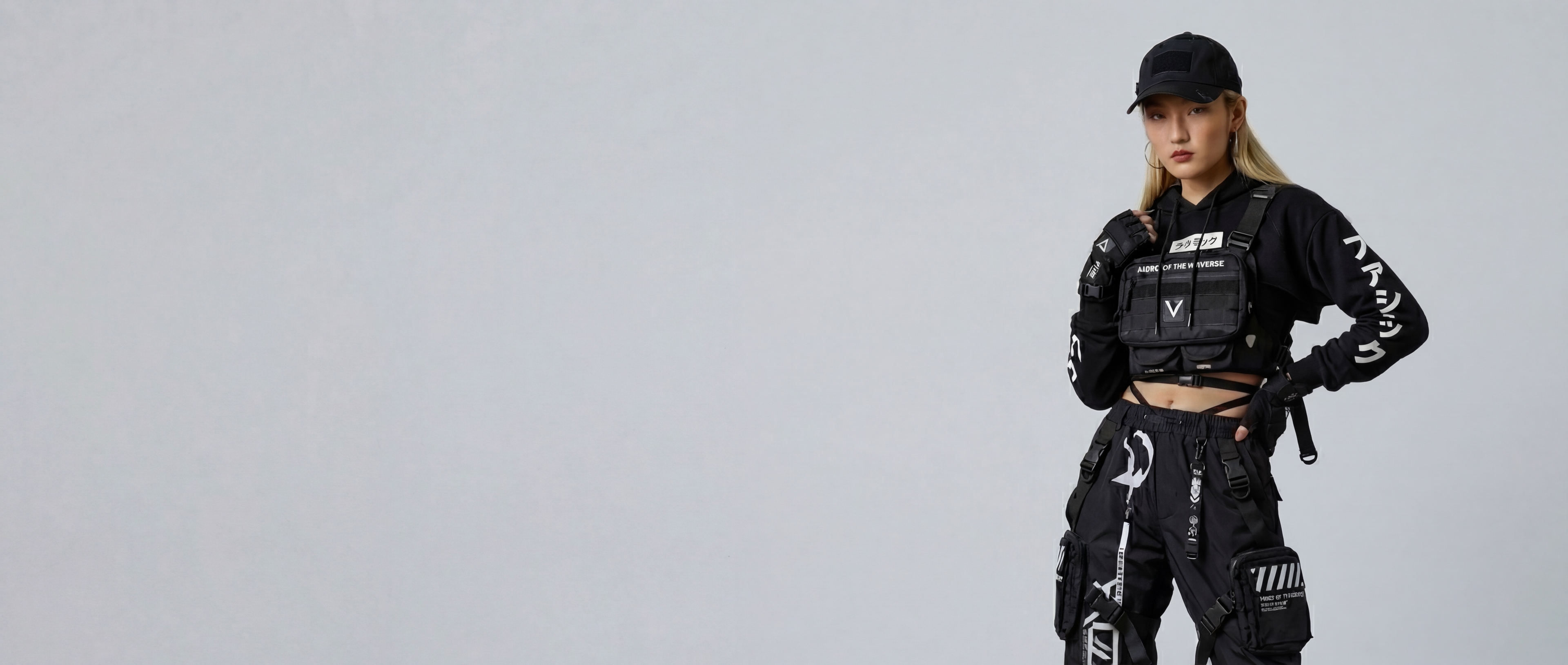 AI generated fashion model who is a asian woman wearing a black techwear outfit.